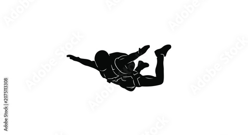 Silhouette of skydivers falling through the air with arms outstretched in exhilaration