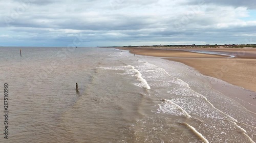 Aerial view of waves crashing on Crosby Beach Liverpool at daytime