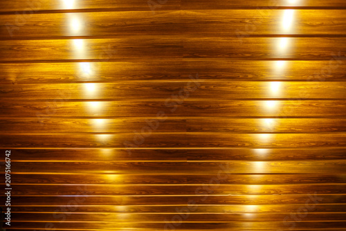 Bild auf Leinwand Wooden Plank Wall with Spotlight Reflections Warm Background