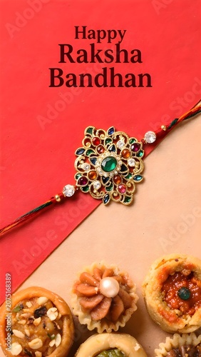 Traditional rakhi with sweets on red and golden surface, Raksha Bandhan ritual setup