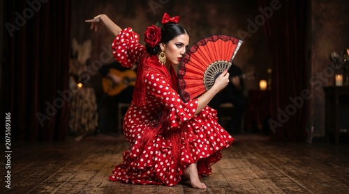 young woman red polka dot dress bow holding fan flamenco dancer
