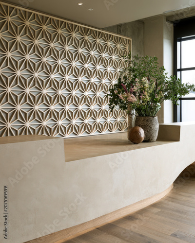 Modern Reception Lobby with Curved Desk, Geometric Wall Pattern and Green Plants