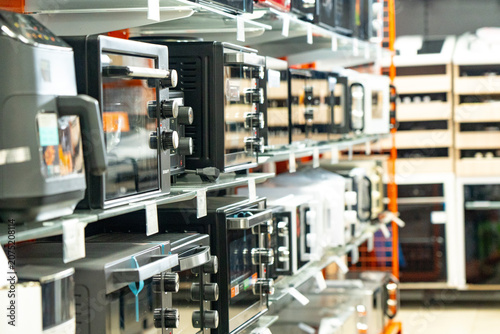 A Diverse Range of Modern Kitchen Appliances on Display: A Showcase of Microwave Ovens Featuring Various Designs, Sizes, and Functions for Every Culinary Need