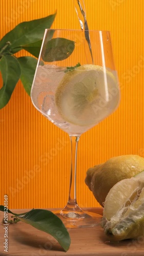 Refreshing Citrus Drink Pouring into Glass