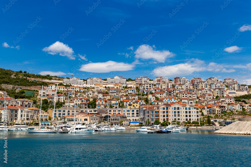 Obraz premium Upscale stone villas and elegant coastal architecture of the exclusive Lustica Bay luxury resort community