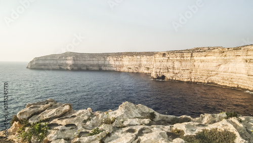Cliffs  hanging over the sea of the Dwejra bay on Gozo Island in Malta