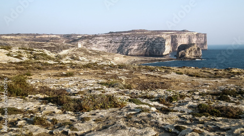 Cliffs  hanging over the sea of Dwejra bay on the Gozo Island in Malta