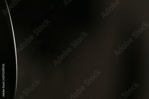 Obraz na plátně real dust particles floating in room with harsh light from light fixture