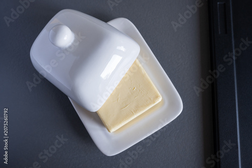 Ceramic block of butter on the table.