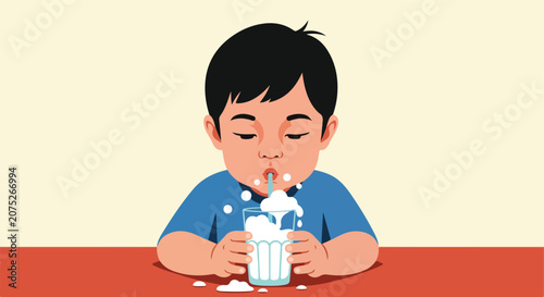 Young child drinks milk with a straw, spills some on table