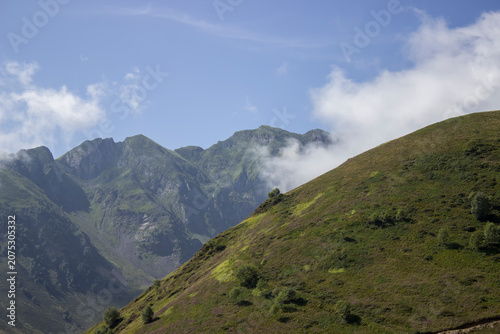 view of hills and mountains in the clouds