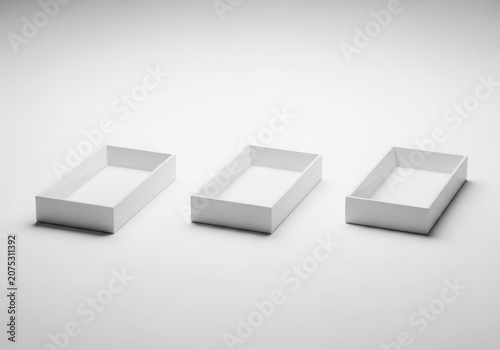 Three Empty White Boxes Side by Side on a Plain Background for Product Display