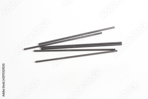 Tableau sur toile A collection of scattered mechanical pencil leads, isolated on a white background