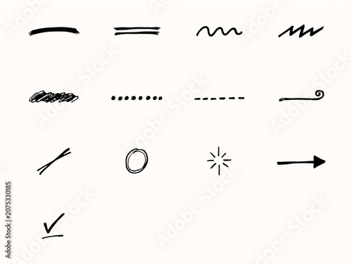 A collection of hand-drawn scribbles, underlines, and symbols typically used for marking or highlighting text.