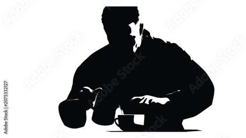 Silhouette of Man Drinking Coffee at Table.