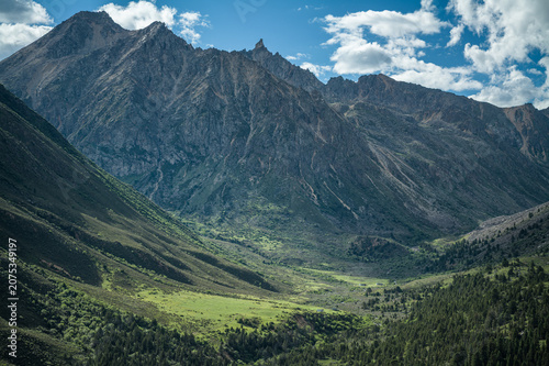 Bilde på lerret Long-Distance Aerial View of Mount Ge'nyen: Alpine Valley, Meadow Pasture and Co