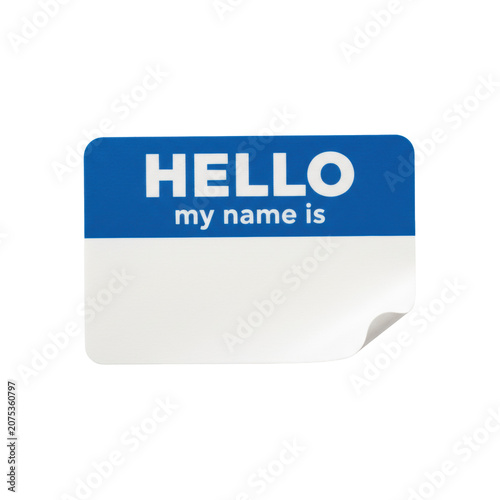 A single adhesive name tag with a cerulean blue header and blank white space, one corner curled upward on a transparent surface, social introduction concept