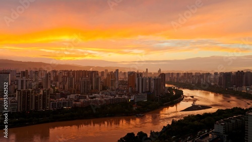 Lanzhou skyline at sunset over the Yellow River, China