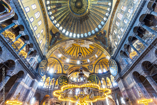 Fotografie Interior view of Hagia Sophia Mosque with visitors beneath its historic dome in