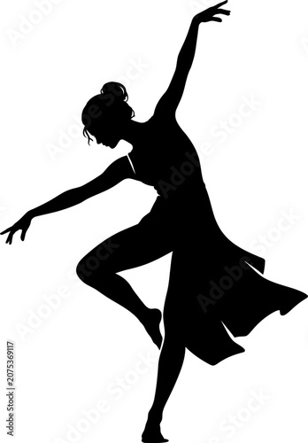 A woman performs a dynamic dance move in a flowing dress indoors.