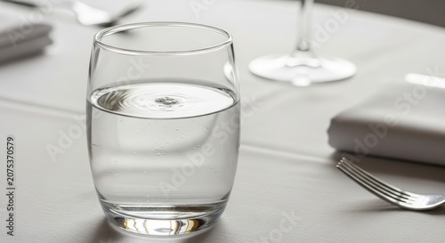 Water Glass Reflects Light at Elegant Dining Table Setting