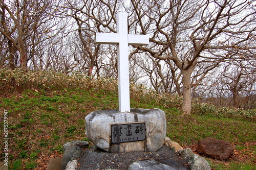 White wooden monument cross standing at Cheseborough Monument Park in Shariki Tsugaru Aomori Japan