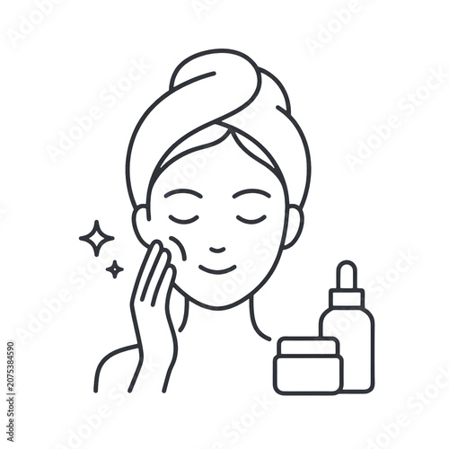 Woman applying facial skincare cream.