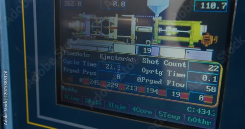 Close-up view of digital control panel displays parameters industrial injection molding machine. Manufacturing and automation, industry 4.0, and technology-focused campaigns