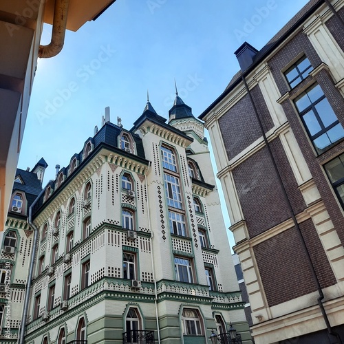 Low angle view of beautiful modern townhouses with elegant classic european architecture style in a city