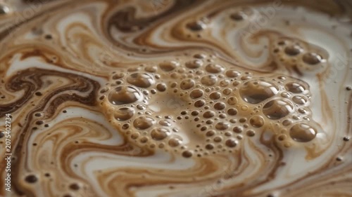 Beautiful Slow Motion Swirl of Rich Espresso Pouring into Steamed Milk