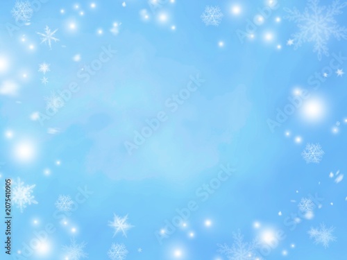 Blue winter background with sparkling snowflakes and bokeh light effects