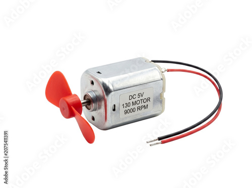 Small DC electric motor with red plastic fan for electronic projects and DIY electronics, isolated on transparent background.