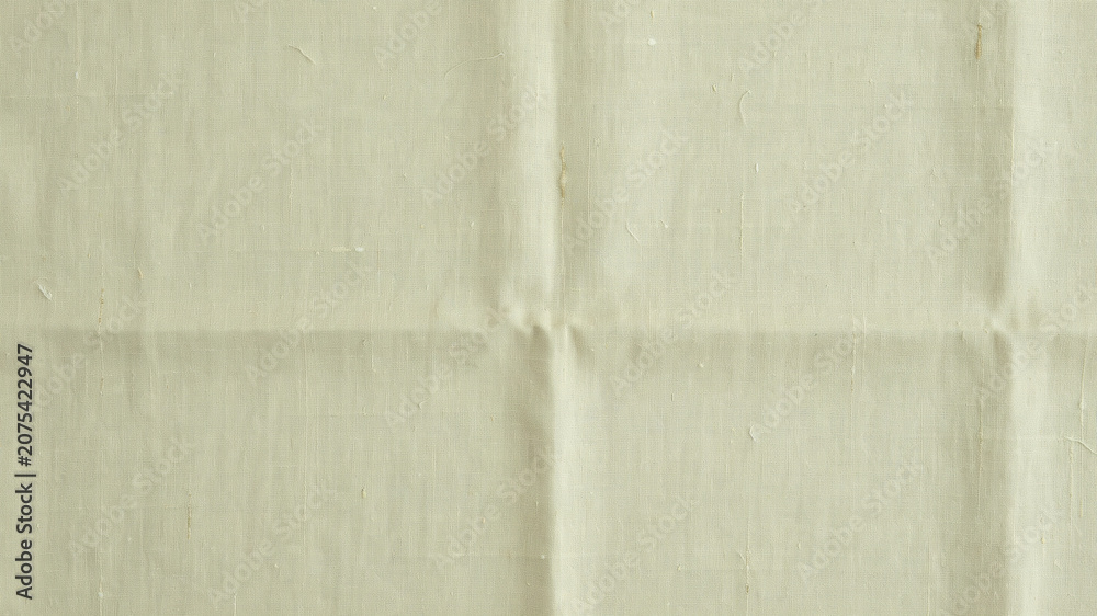 Fototapeta premium Wrinkled beige fabric texture, creased cloth background, neutral colored linen, folded material