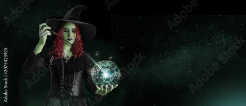 Obraz na plátně Witch with a magic wand casts a spell with magic Crystal ball for predictions fortune-telling