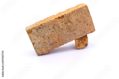 Red old single brick isolated on white background.