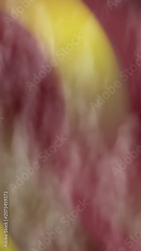 Vertical Abstracts Smoke Abstract background with blurred yellow and pink colors creating a soft and dreamy texture effect perfect for cheerful design