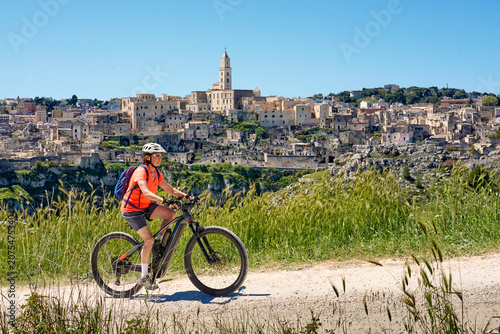Active woman riding an elec...