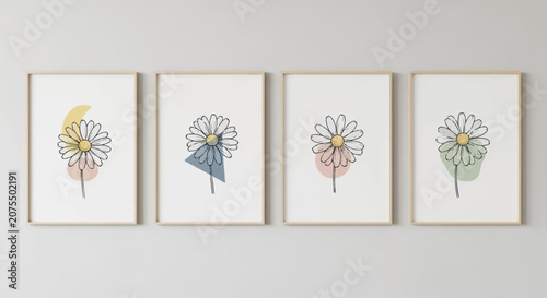 Minimalist Line Art Flower Prints Set with Daisy Blooms and Soft Watercolor Washes in Wooden Frames on a Light Beige Wall.