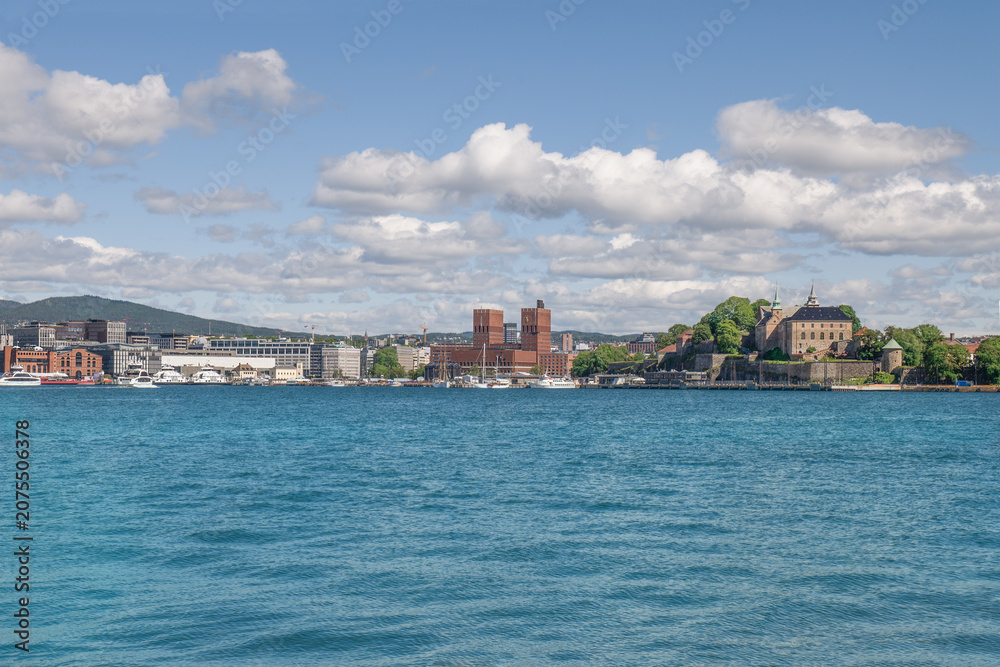 Fototapeta premium Oslo City Hall landmark towers and Akershus fortress. Skyline of Oslo, Norway