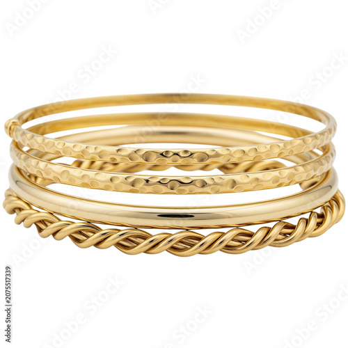 Fotografie Stacked gold bangles with textured and smooth designs