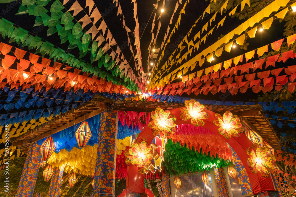 Fototapeta premium Traditional Brazilian Festa Junina Decoration with Colorful Paper Lanterns and Bunting Flags