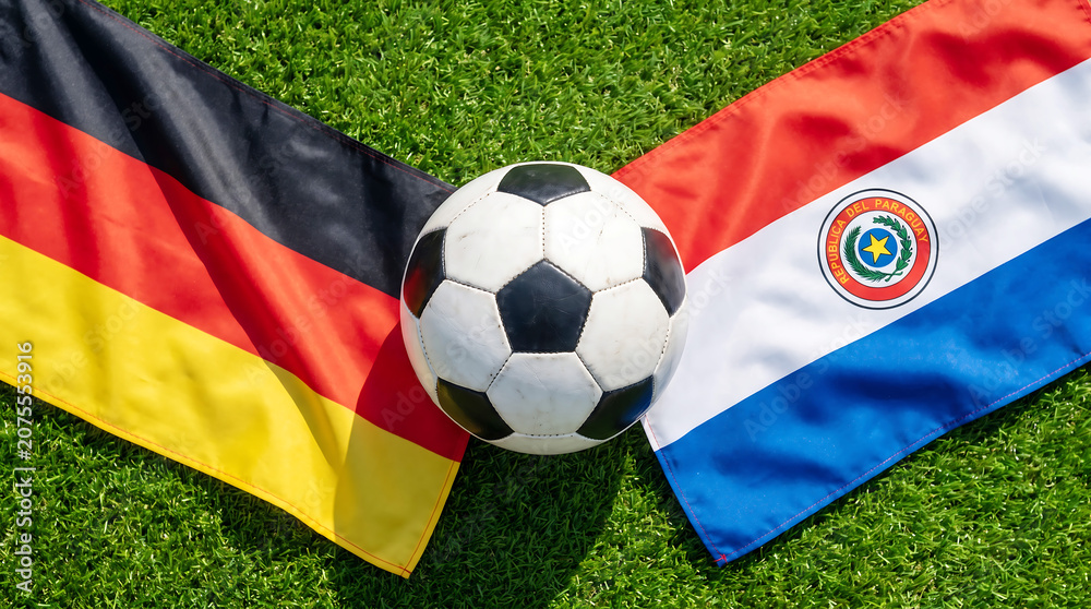Fototapeta premium Germany versus paraguay soccer match football on national flags
