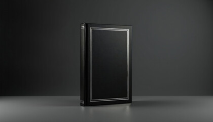 Elegant black book with silver embossed borders stands alone. Minimalist hardcover offers space for portfolio, design, or writing. Classic object on dark grey studio backdrop.