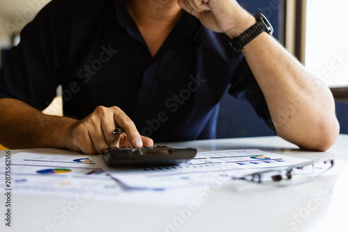 Financial analysis with calculator, interest rate, inflation and investment growth concept