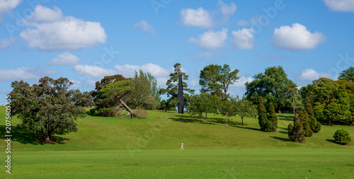 Expansive green lawn with modern sculpture and trees in Auckland Domain, Auckland, New Zealand, 1 January 2024