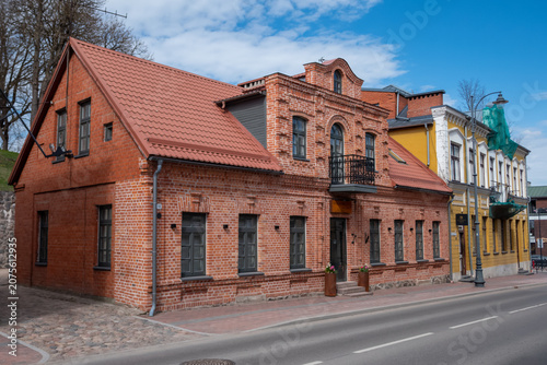 Historic brick houses on a quiet town street