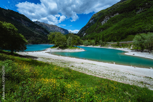 Quadro su tela The view of Lake Tenno, a splendid alpine lake nestled between mountains and woo