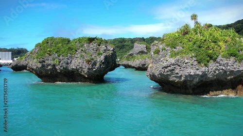 Aerial view of rock cliffs in the turquoise sea, Okinawa, Japan.
