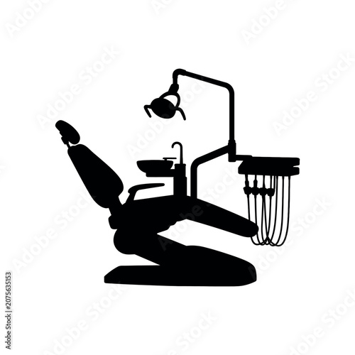 Dental chair with attached light and instrument tray silhouette on white