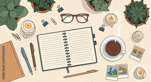 Overhead flat lay of a creative desk with an open diary, hot cup of coffee, green plants, and tiny photos.